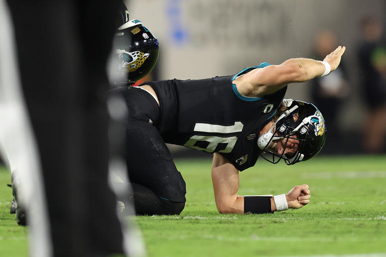 Trevor Lawrence #16 of the Jacksonville Jaguars reacts after being injured against the Cincinnati Bengals during the fourth quarter at EverBank Stadium on December 04, 2023 in Jacksonville, Florida. What do we know about the quarterback's status so far?