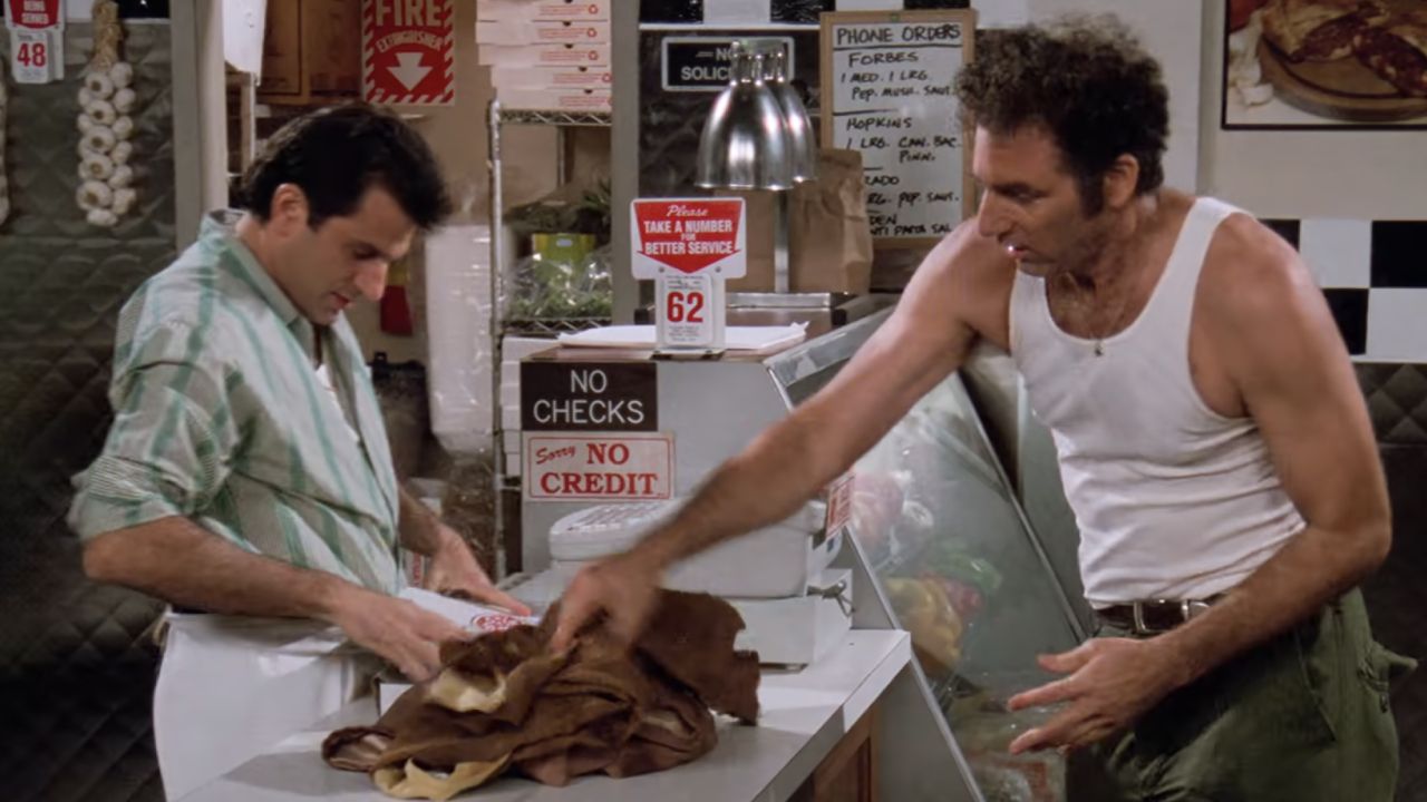 <p>                     Kramer tries to keep his clothing fresh and warm as often as possible, which means quite a few trips to the laundromat. However, while picking up some calzones for George, he thinks he finds a loophole and asks the owner, Mario (Peter Allas), if he can put his shirt and jacket in an oven. It works a little too well, though, leaving the clothes burnt and too warm to wear.                   </p>