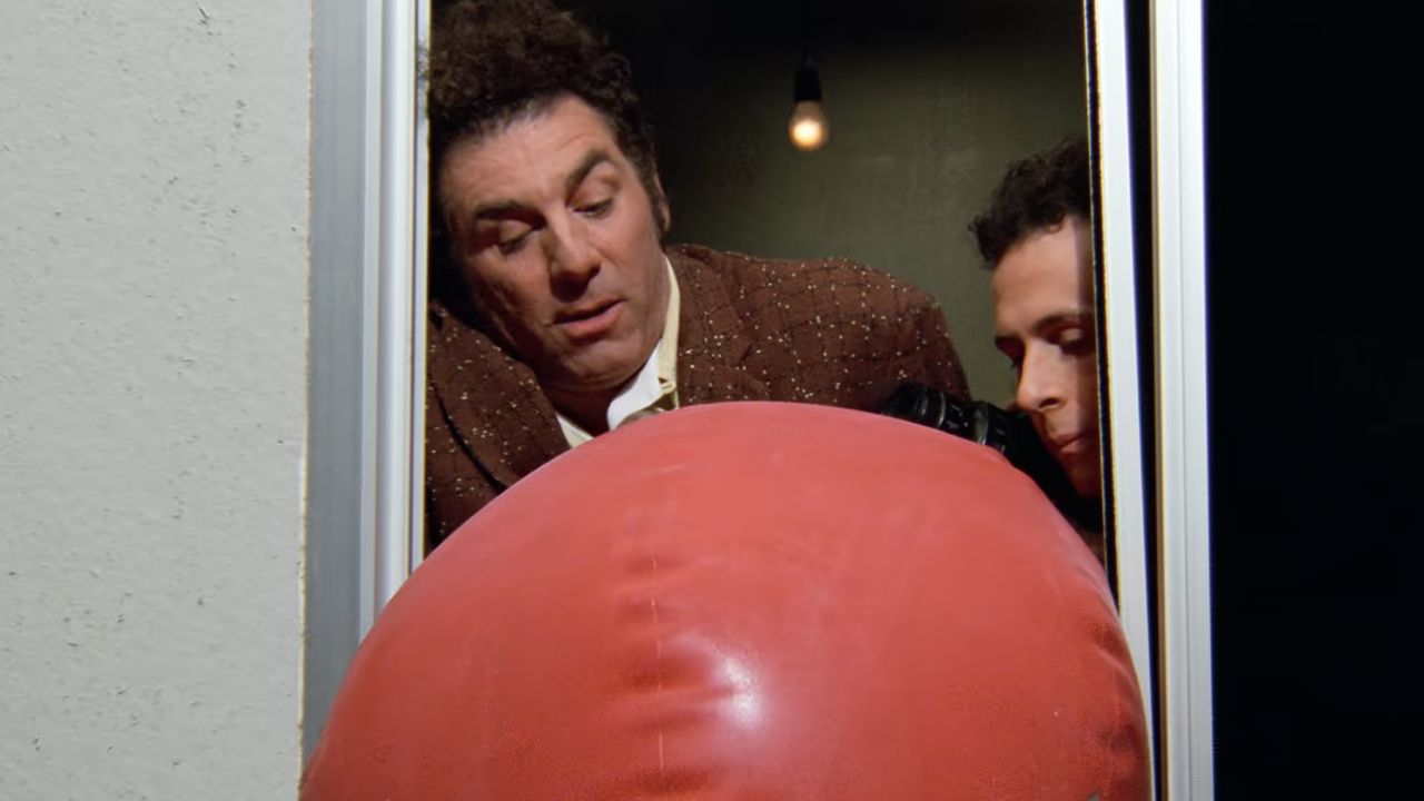 <p>                     Kramer hires a college intern named Darin (Jarrad Paul) to take care of his daily tasks so he can have more time to develop ideas – such as a rubber bladder that would help prevent oil tanker spills. With help from George (Jason Alexander), they test the potential Kramerica Industries product by dropping a rubber ball of oil out a window, which proves faulty when it splatters on Jerry’s girlfriend, Claire (Sarah Peterson).                   </p>