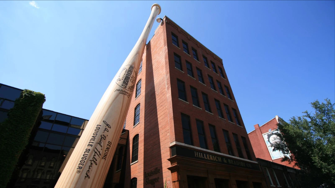 <p><span>Second to Bourbon, there’s plenty of baseball history in Louisville. Did you know the </span><a class="editor-rtfLink" href="https://www.sluggermuseum.com/" rel="nofollow noopener"><span>Louisville Slugger Museum & Factory</span></a><span> produces over 1.8 million wood bats annually? You can’t miss the giant bat, a replica of Babe Ruth’s bat, that stands 120 feet tall outside the museum. Guests can tour the factory to see how the bats are made and take home a mini bat!</span></p><p>The museum includes a bat vault where you can see a collection of bats used by the most famous <a href="https://wealthofgeeks.com/baseball-movies-watch-now/">baseball</a> players. If you upgrade your factory tour, they’ll personalize the experience according to your favorite players and teams. Plus, the upgraded tour includes a personalized mini bat.</p>