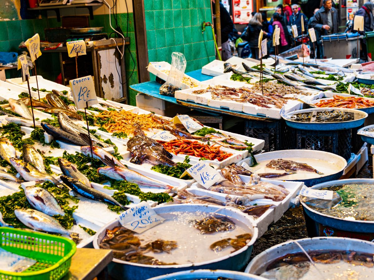 Oistins Fish Market in Barbados is a vibrant and bustling seaside marketplace known for its fresh seafood and lively atmosphere, it features a variety of stalls where local fishermen sell their daily catch.