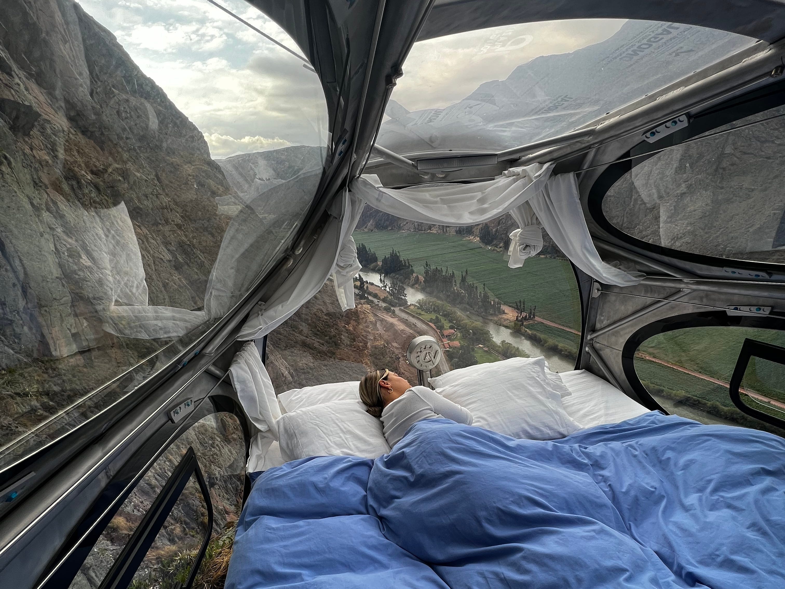 i climbed a terrifying 1,200 feet to stay in a transparent pod suspended off the side of a cliff in peru
