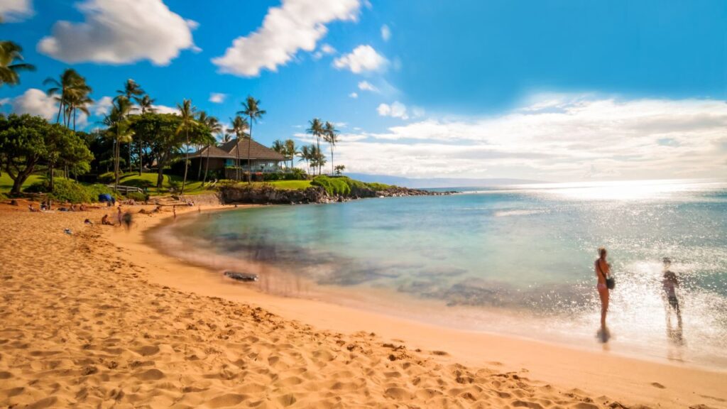 <p>Kapalua Bay, located in West Maui, is known for its calm waters and excellent snorkeling conditions. The beach is crescent-shaped and offers a protected area perfect for families. The bay is surrounded by greenery and luxury resorts. It's also an excellent spot for paddleboarding and kayaking.</p>