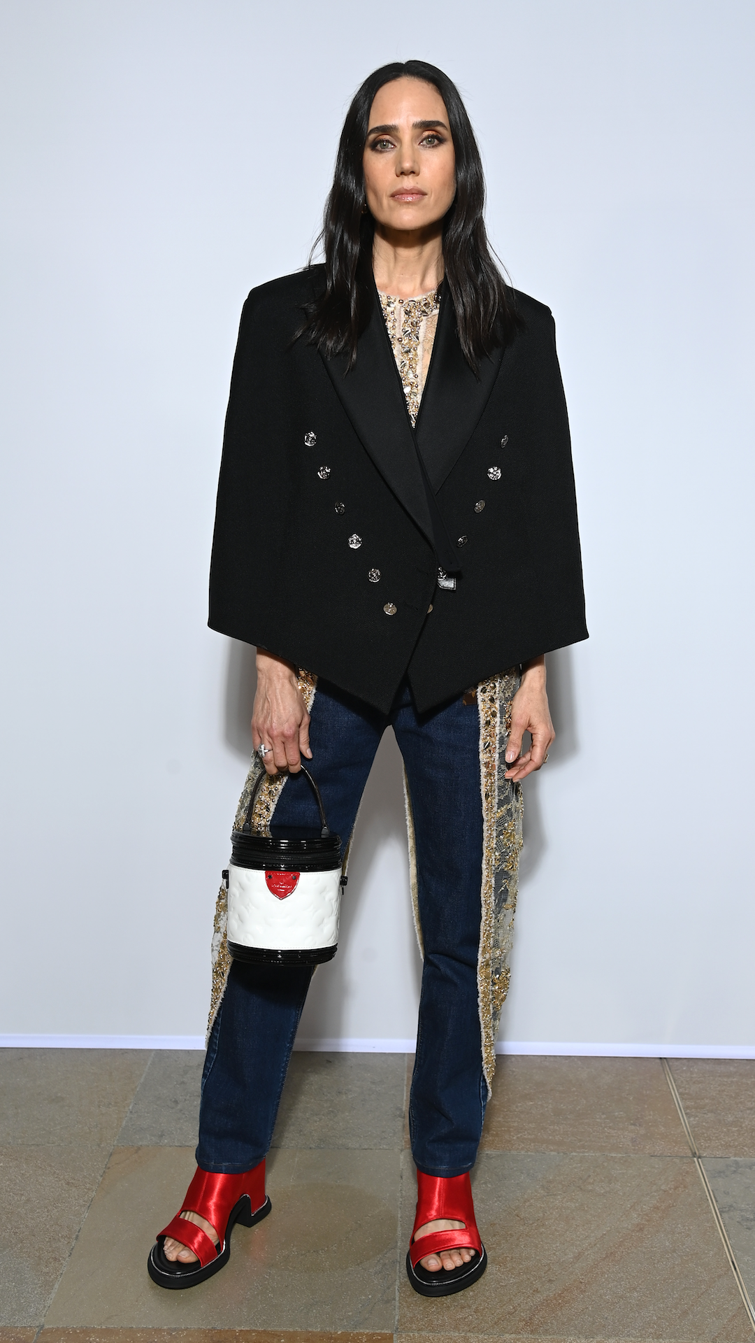 <p>                     Slim-fit denim makes one of the best jeans styles for dressing up or down. Connelly took the former approach to attend the Louis Vuitton show during Paris Fashion Week in 2022. She wowed in an embroidered navy pair with an embroidered detail down the leg, along with a black tuxedo-style jacket. The actress accessorised with a statement bucket-style handbag and metallic chunky red-heeled sandals.                   </p>