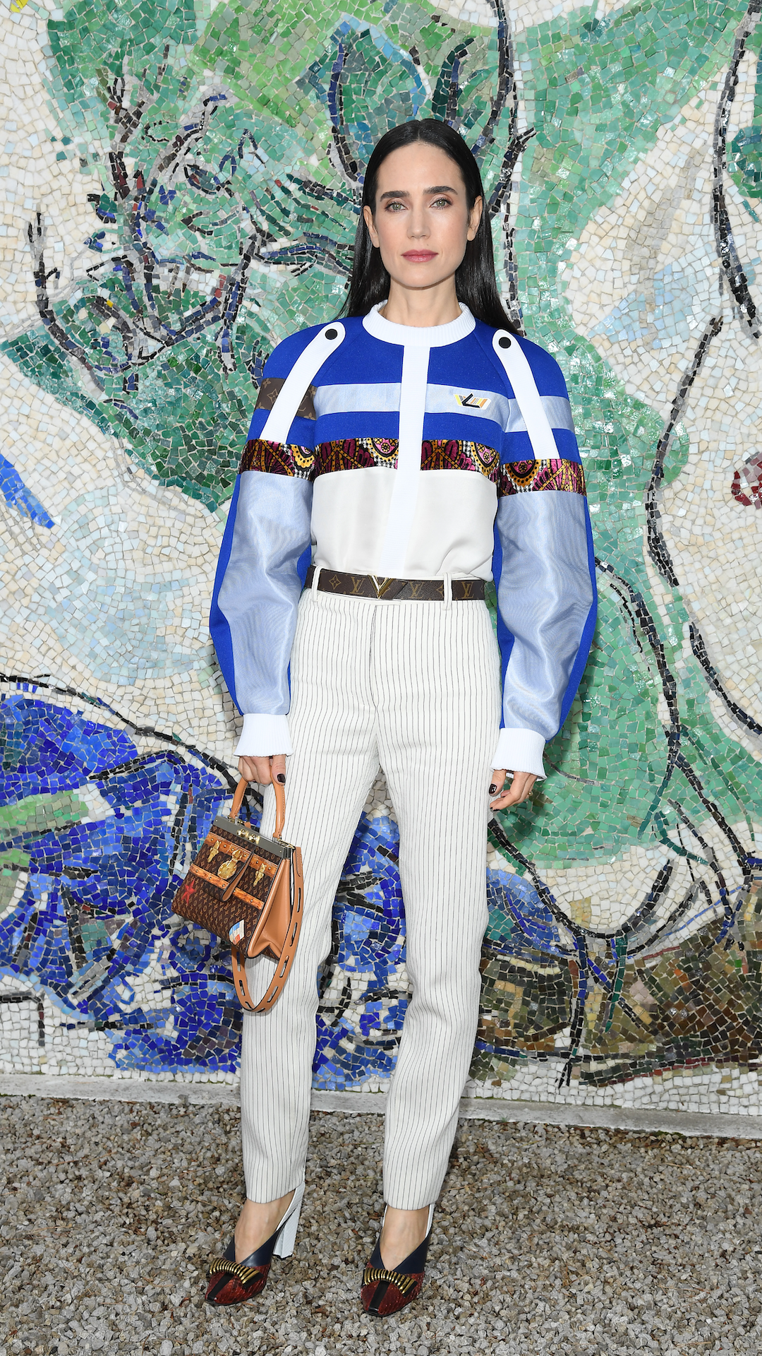 <p>                     Not one afraid to make a sartorial statement, Connelly mixed things up for a Louis Vuitton show in Saint-Paul-De-Vence, France in 2018. The actress clashed her eye-catching top, which featured a voluminous silhouette, with a pair of slim-fit striped trousers. She accessorised with a brown monogrammed Louis Vuitton handbag and belt.                   </p>