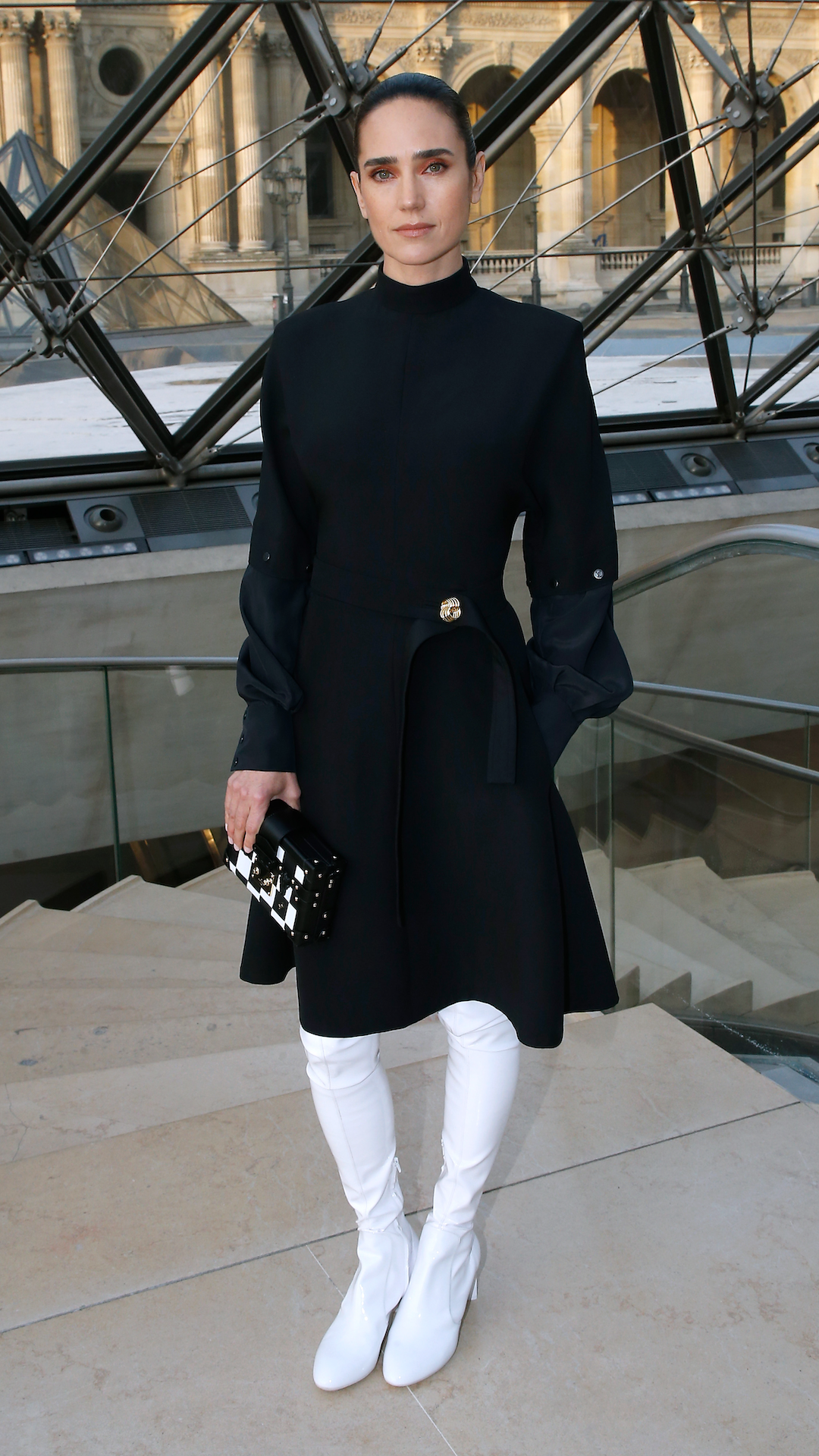 <p>                     Connelly looked sharp at the Louis Vuitton show during Paris Fashion Week in 2017. The star was stylish in a long-sleeved black skater-style dress, featuring gold brooch detailing at the hip. She finished off the monochrome ensemble with thigh-high white boots and a black and white statement clutch bag.                   </p>