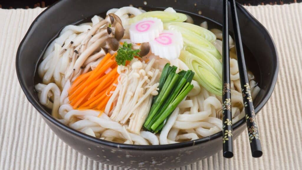 <p><span>Udon are thick, chewy wheat noodles served in a savory broth, often accompanied by ingredients like tempura, tofu, and green onions. It's a staple in Japanese cuisine, known for its comforting and subtle flavors.</span></p>