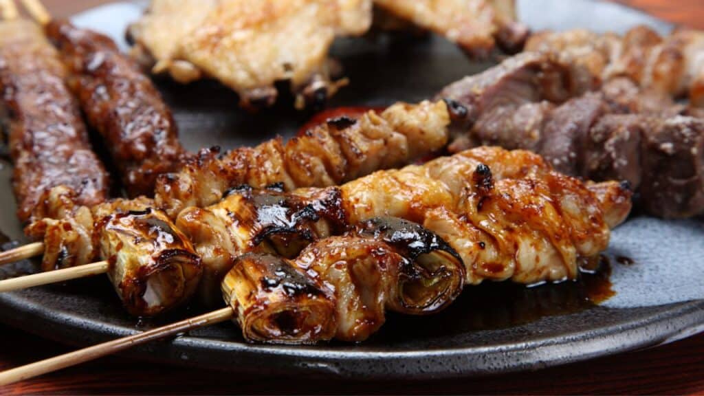 <p><span>Yakitori consists of skewered and grilled chicken, often seasoned with salt or a sauce made of soy sauce, mirin, and sugar. This street food favorite is cooked over charcoal, which imparts a smoky flavor. It's a social food, commonly enjoyed with friends and a cold beer.</span></p>