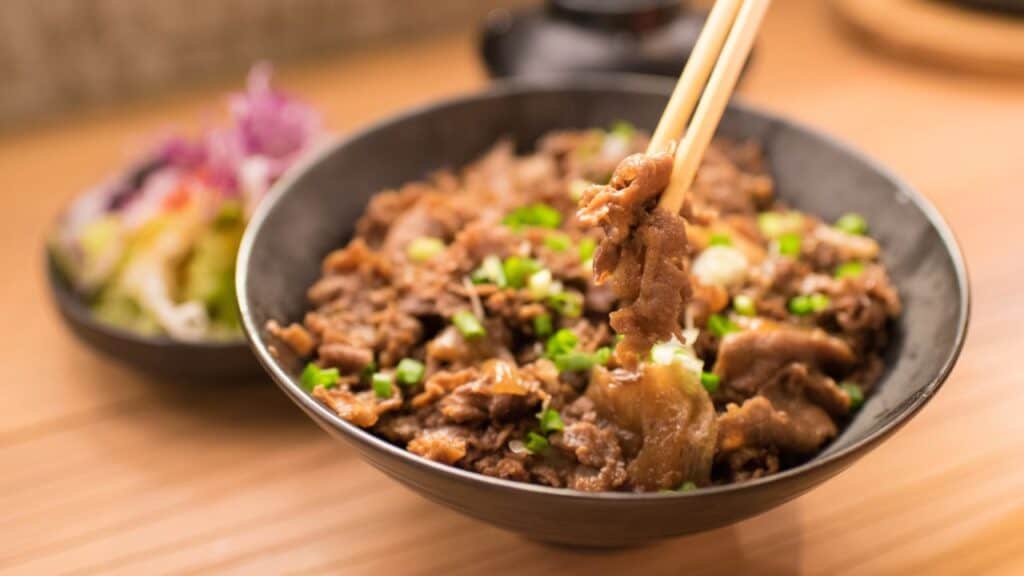 <p><span>Gyudon is a rice bowl with thin slices of beef and onions, simmered in a mildly sweet sauce combining soy sauce and mirin. This quick and hearty meal is a favorite among those looking for a satisfying, flavorful, affordable, and ubiquitous dish in Japan.</span></p>