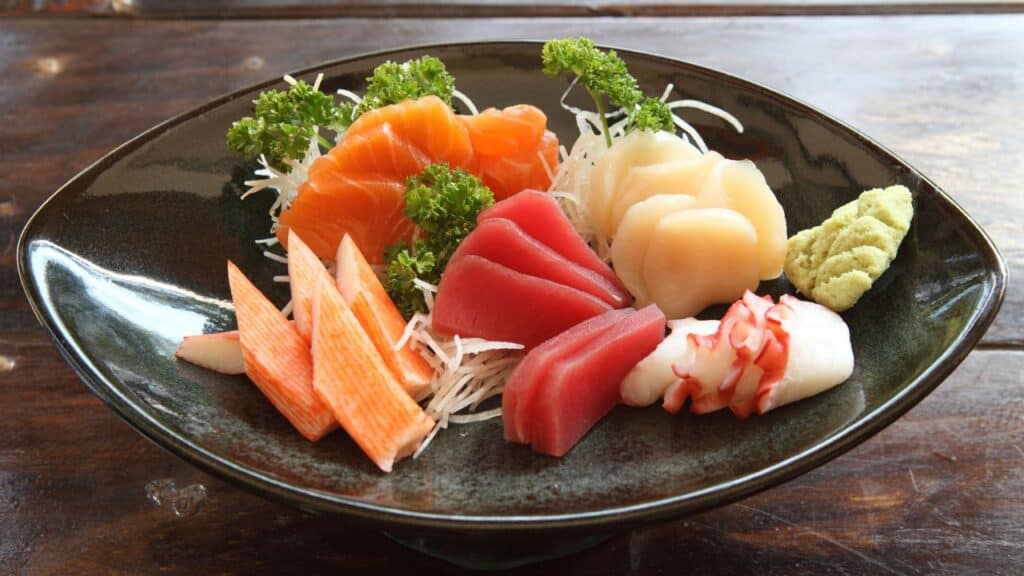 <p><span>Sashimi is a delicate and elegant dish of fresh sliced raw fish served with soy sauce and wasabi. It is often confused with nigiri, vinegared rice balls topped with raw fish. </span></p>