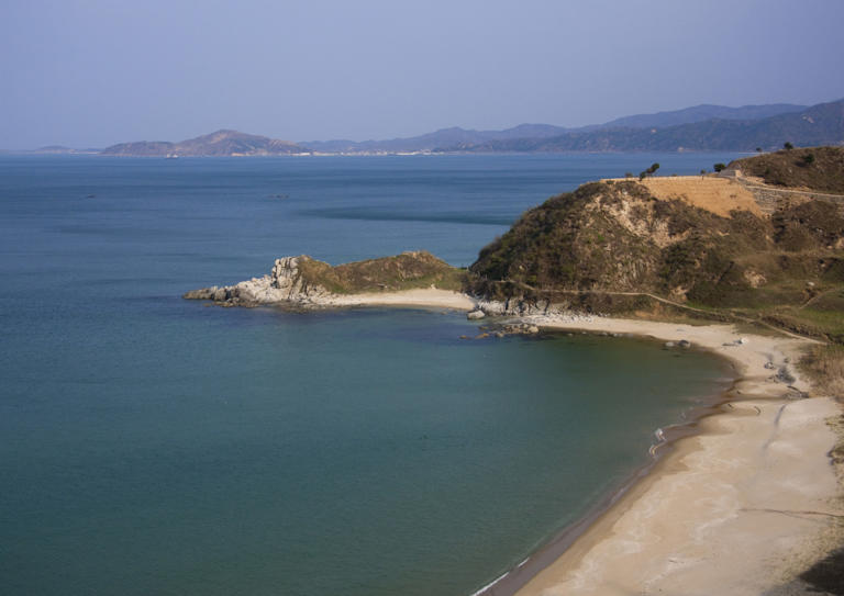 Beach along the coast, Kangwon Province, Wonsan, North Korea on May 1, 2010 in Wonsan, North Korea. Kim Jong-un has allegedly ordered construction to resume on the Wonsan-Kalma Coastal Tourist Zone in Wonsan, North Korea. The project will offer water parks, hotels and an airfield.