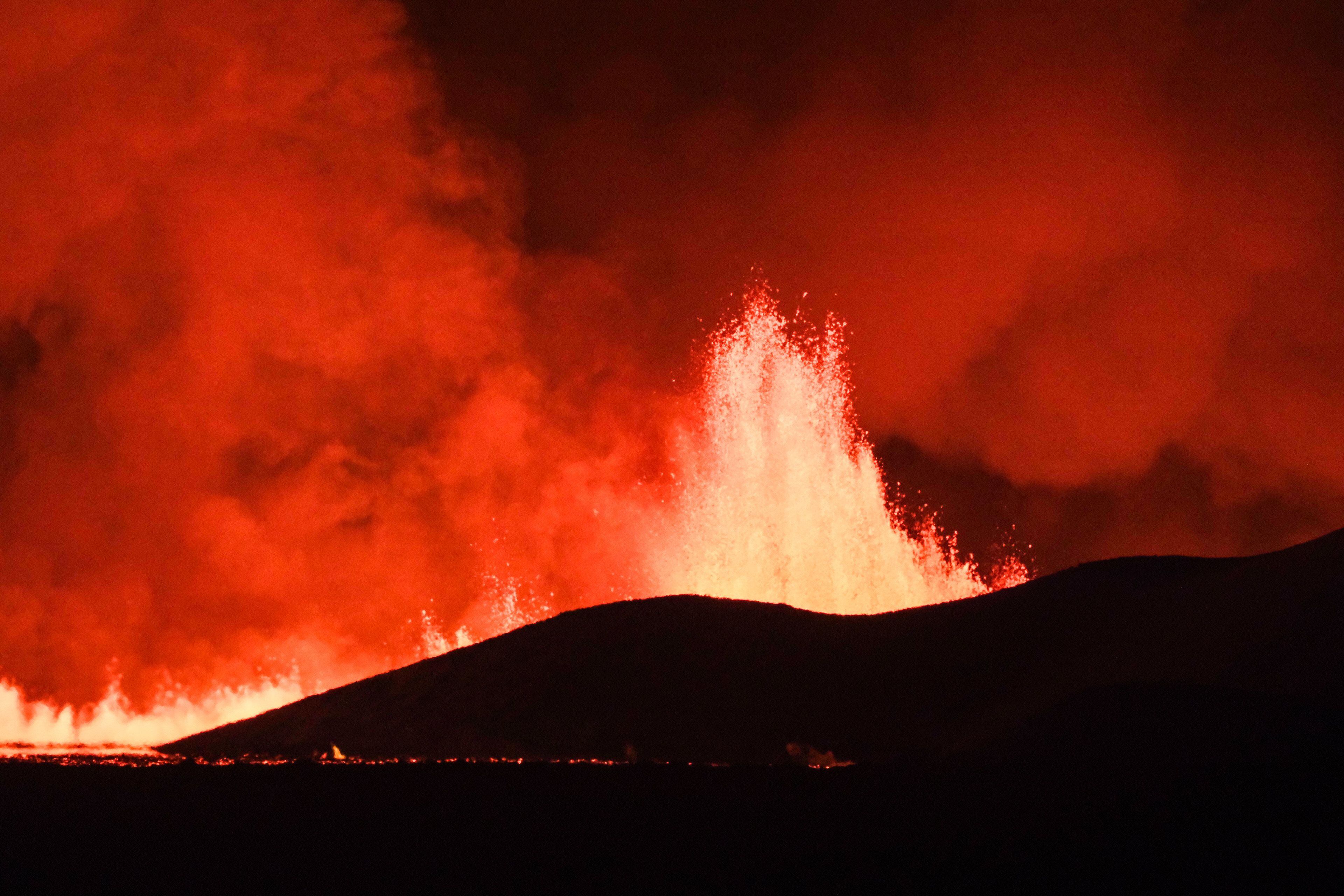 iceland volcano eruption: president warns of 'daunting' period as lava destroys homes