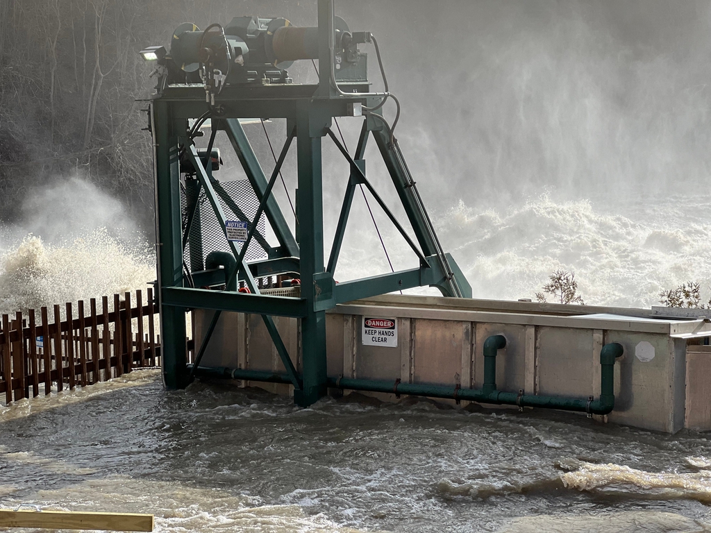 Rough and overflowing waters are seen in The Winooski River after major ...