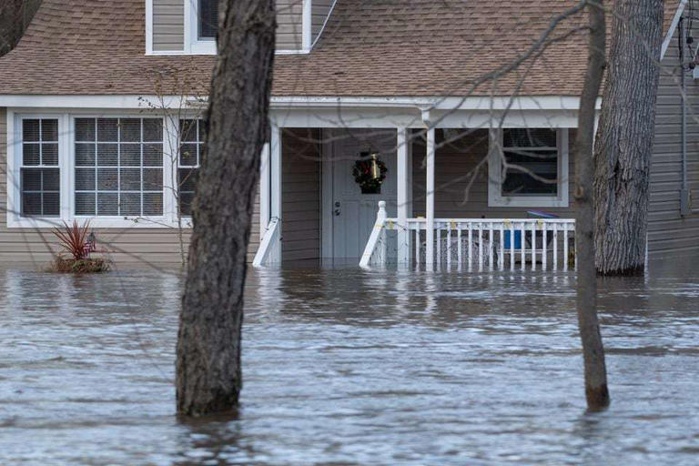 Flooding along houses on the Pompton River near Fairfield Road in Wayne on Tuesday, December 19, 2023.
