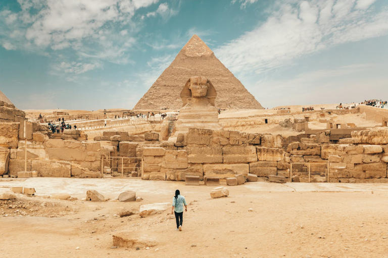 Check out these 50 Travel Bucket List destinations. Pictured: A pyramid and the Great Sphinx of Giza.