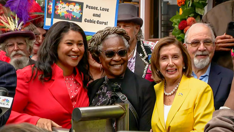 Fannie Mae Barnes (center), the first woman to become a cable car grip operator, was honored with an award presented to her by San Francisco Mayor London Breed (left) and U.S. Rep. Nancy Pelosi (right, D-San Francisco), who was the first woman to become Speaker of the House.