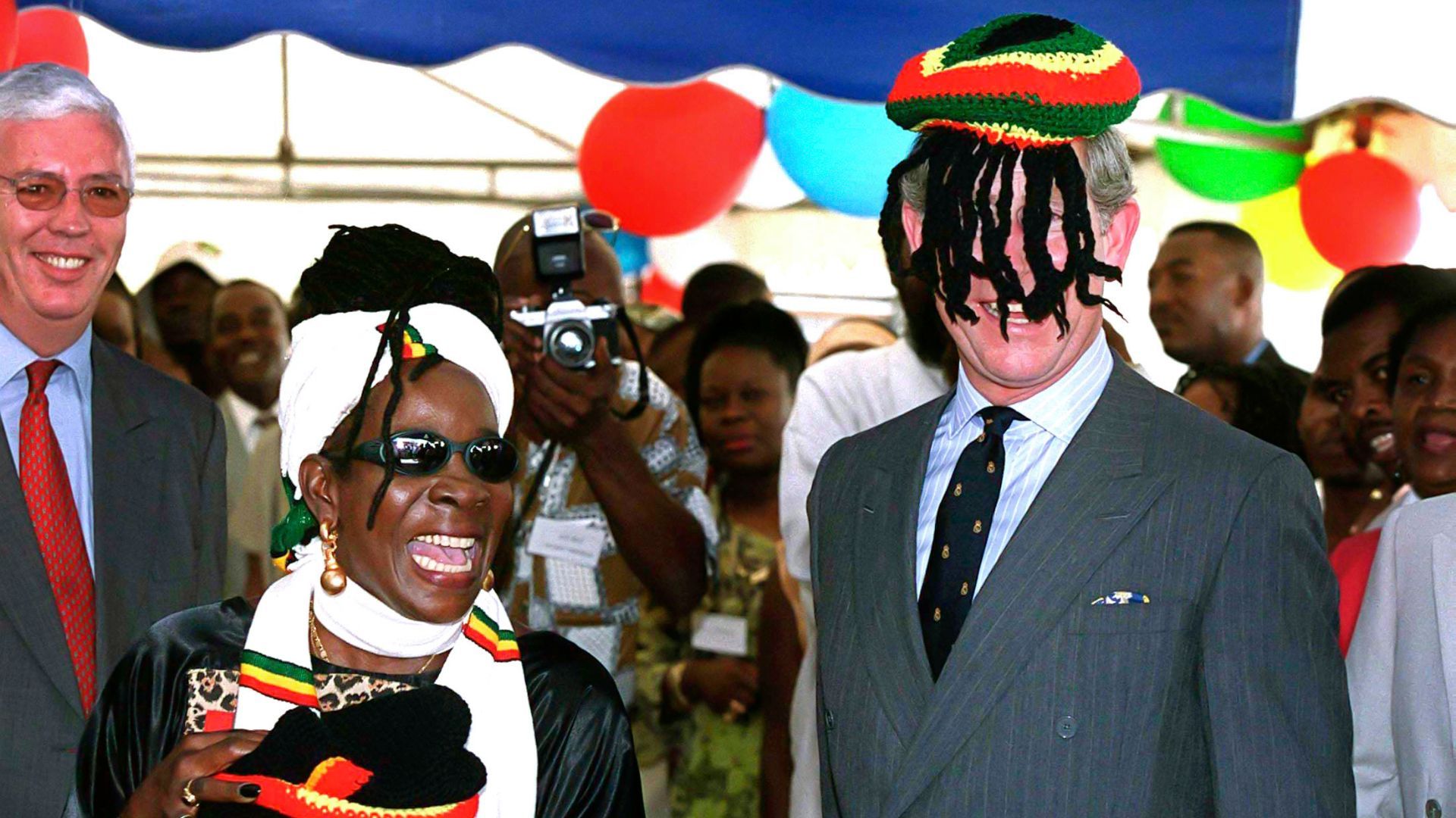 <p>                     No, that's not a permanent marker on the photo - just a minor fashion mishap. On his 2000 visit to Jamaica, Charles met the wife of the late Bob Marley, Rita Marley. While in Kingston, he was given a Rasta cap which he accidentally put on his head backwards covering his face. Both he and the crowd around him thought it very amusing.                   </p>