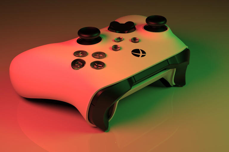 Close up of Xbox Series X white controller in red and green light