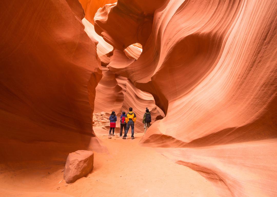 <p>Although the town of Page, Arizona, is located five hours from major cities like Las Vegas and Phoenix, the natural splendor of <a href="https://antelopecanyon.az/what-is-antelope-canyon/">Antelope Canyon</a> more than makes up for the trip. Visitors can tour the Slot Canyon formation's beautiful red and golden-hued, famously narrow turns.</p>