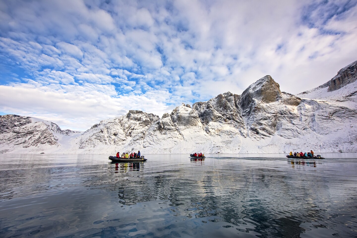 <h2>Sustainability</h2> <p>There is one indisputable con to both Arctic and Antarctic cruises: the impact on the environment. Indeed, <a class="Link" href="https://www.afar.com/magazine/is-it-safe-to-cruise-in-antarctica" rel="noopener">reports about the record number of ships</a> cruising into these fragile environments and the increasing speed of ice melt gave me pause.</p> <p>The good news is that the newest class of expedition ships sailing to polar regions—vessels both big and small—have the latest in green technology. For instance, <i>World Voyager</i> is equipped with some of the most advanced sonar, stabilization, and engine technologies, including a hybrid electric-diesel engine and a hydro-jet propulsion system for smoother, safer, and more energy-efficient rides.</p> <p>And I’ve never met a group of people more committed to protecting the wildlife and the environment than the expedition team members I have sailed with in the world’s polar regions. Whether it’s onboard lectures or conversations while hiking or riding a Zodiac, they really provide a nonstop education about these environments, the wildlife, and the dangers humans and climate warming present.</p> <p>The pro to the con? As one expedition leader told me, after sailing in the polar regions, most travelers go home hyper-aware of their environmental footprint and the real dangers we all pose to the majestic glaciers, ice caps, and wildlife in the fragile polar zones.</p> <p>Indeed, as I sat in <i>Word Navigator’s</i> Dome Lounge watching a pod of whales playing off the bow as the light from the setting sun cast multiple colors across the stadium-sized icebergs, mountains, water, and clouds, I realized what people mean when they call a trip to Antarctica life-changing—and one that no doubt has created many lifelong stewards of the environment.</p> <p><i>In the photo at the top of the story, the left image is of a Zodiac outing in Antarctica and the right image is a Zodiac group exploring Greenland in the Arctic.</i></p>