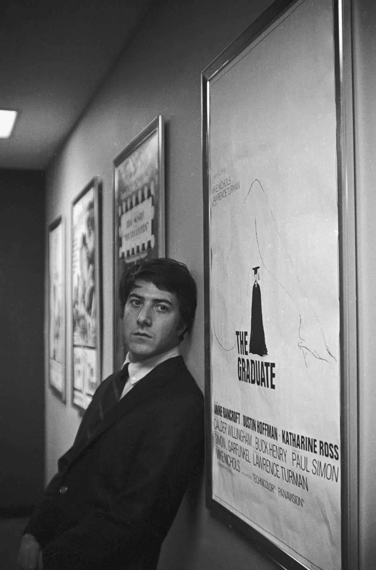 <p>Before Dustin Hoffman was known as a huge name in Hollywood, he was Benjamin Braddock, a college graduate with no real plan for the future. Enter Mrs. Robinson, the older woman who gets on Braddock's radar only for him to fall for her daughter.</p> <p><i>The Graduate </i>went on to be the highest-grossing film worldwide when it was released in 1967. Little did Hoffman know while he was standing next to the theater poster that he was about to become a huge star.</p>