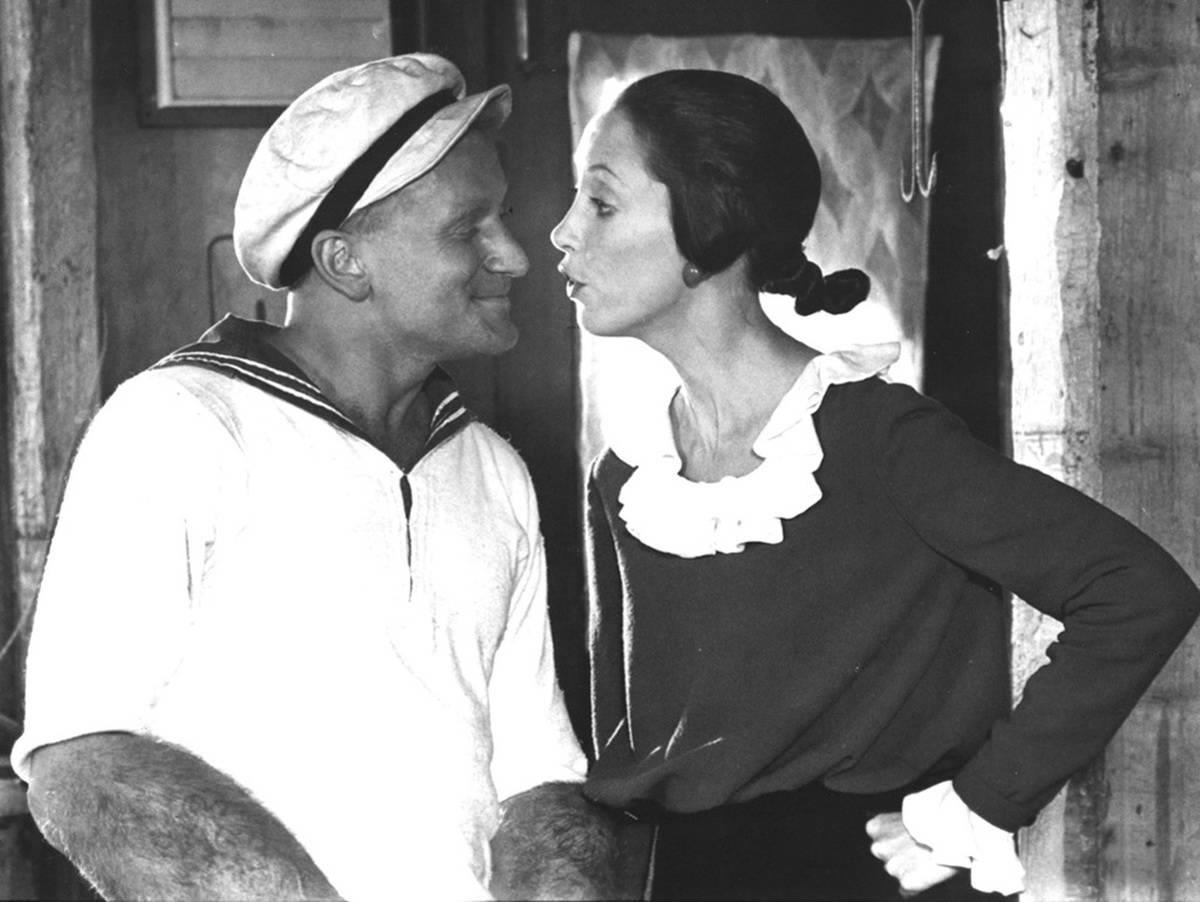 <p>1980 brought us the comedic genius of actors Robin Williams and Shelley Duvall in the musical <i>Popeye</i>. Williams starred as the title character while Duvall played the role of his love interest Olive Oyl. </p> <p>The film went on to gross $49.8 million worldwide and received generally positive reviews from critics. This behind the scenes picture definitely illustrates the relationship the two had on set! With Duvall trying to be serious while Williams was his goofy self.</p>