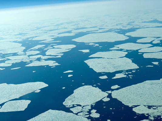 Flying over the Arctic Ocean during an international flight in June 2019. Courtesy of Mark Stevens