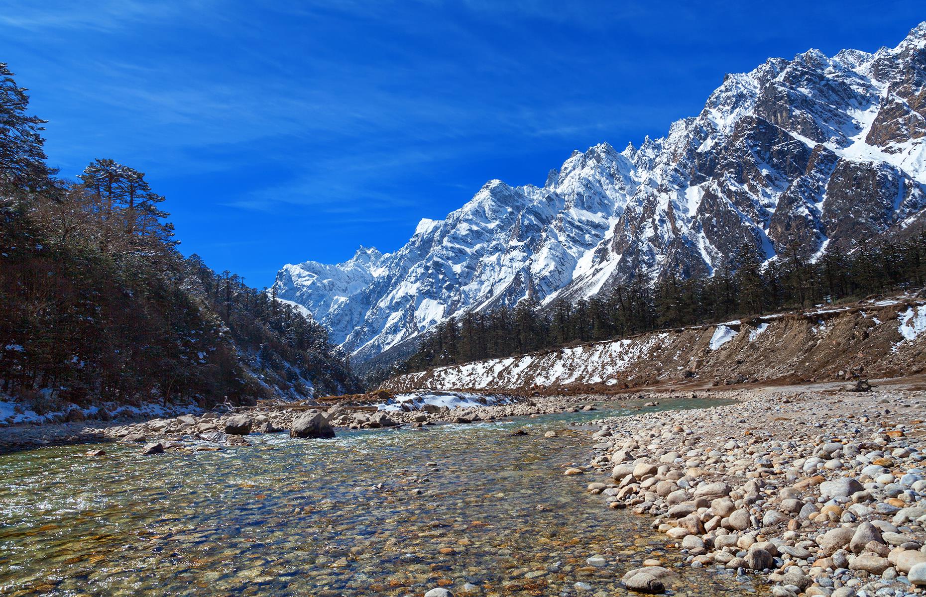<p>Crafted by the winding Teesta River, the Yumthang Valley in far northern India is a mountain paradise. Expect green grassy riverbanks, forested mountainsides, and yaks grazing by the water in this Himalayan beauty.</p>  <p>A nature reserve spreads east of the river and is famous for its gorgeous wildflowers, sweeping grasslands, and a rhododendron sanctuary with over 40 trees.</p>