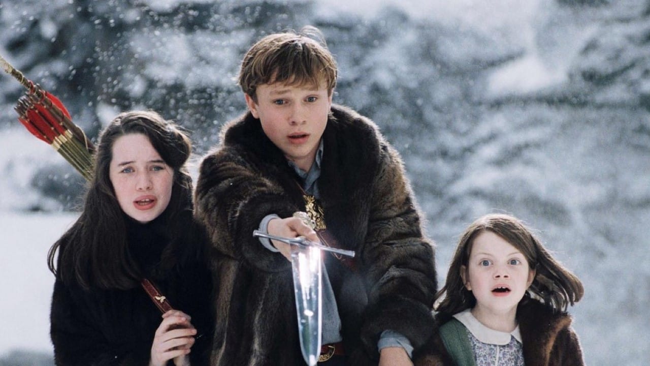 <p>Four siblings, Peter, Susan, Edmund, and Lucy, find a wardrobe within the country home of Professor Kirke. Within the wardrobe sits Narnia, a magical winter world cursed by the White Witch. The perpetual winter symbolizes physical coldness and emotional freeze. Once ripe with warmth and kindness, the land now laden with snow depicts the Witch’s relentless grip on <a href="https://wealthofgeeks.com/winter-movies/" rel="noopener">Narnia</a>. Her coldness pierces the screen and into our rooms.</p>