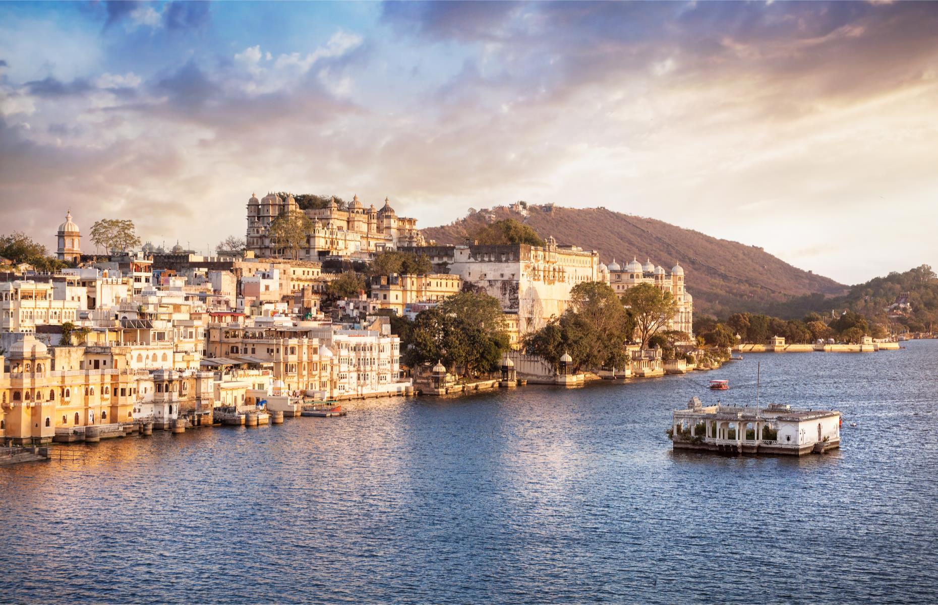 <p>Known as the Venice of the East, Udaipur is arguably India's most romantic city. Take a boat ride around Lake Pichola to admire the white City Palace, once home to the Maharani of Udaipur, and marvel at the Taj Lake Palace which seems to float on the water.</p>  <p>This marble beauty is now an extravagant hotel.</p>