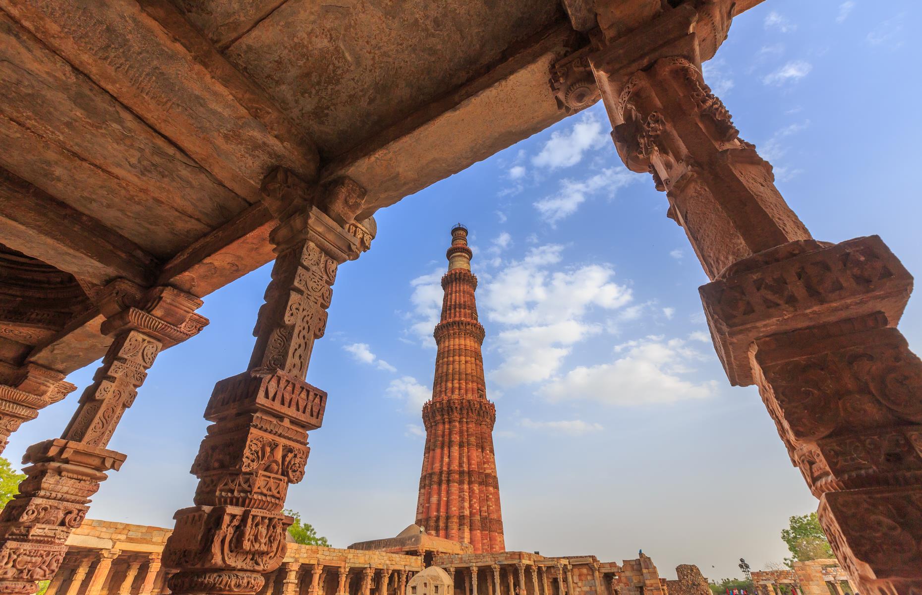 <p>Built in the late 12th century, Delhi’s red sandstone Qutub Minar is the tallest brick minaret in the world, standing at 238 feet. The mosque, a UNESCO World Heritage Site, is one of Delhi’s most impressive highlights, towering over the densely-populated capital in all its chaotic beauty.</p>