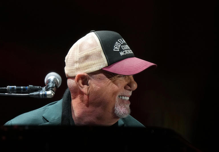 Billy Joel performs with his band at Chase Field on Dec. 8, 2023.