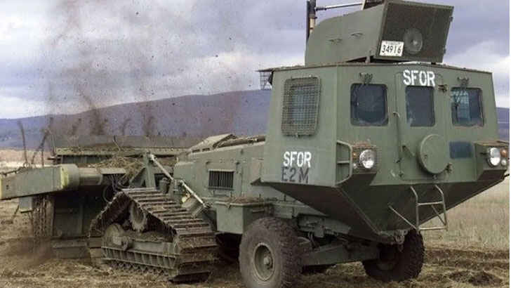 <p>The Aardvark JSFU Mark 4 is a military vehicle with a unique purpose: instead of combat, it is designed for active defense against landmines. Equipped with a flailing system, the vehicle uses a roller that spins large chains at high speed, while a plow-like structure and an armored cabin protect the driver and crew member responsible for operating the flailing system and electronic depth-contouring system. The Aardvark has been used by both military and humanitarian organizations to clear landmines around the world. It has been deployed by British and American forces for landmine clearance in Afghanistan and Iraq, among other places.</p>