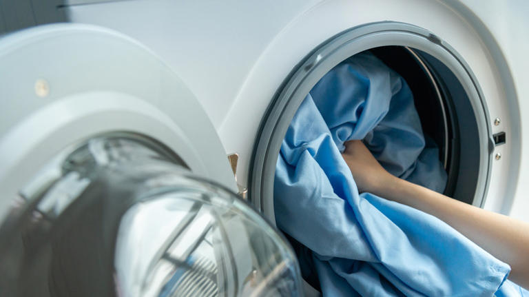 The Simple Laundry Trick That Will Keep Your Bedding From Balling Up In The  Dryer