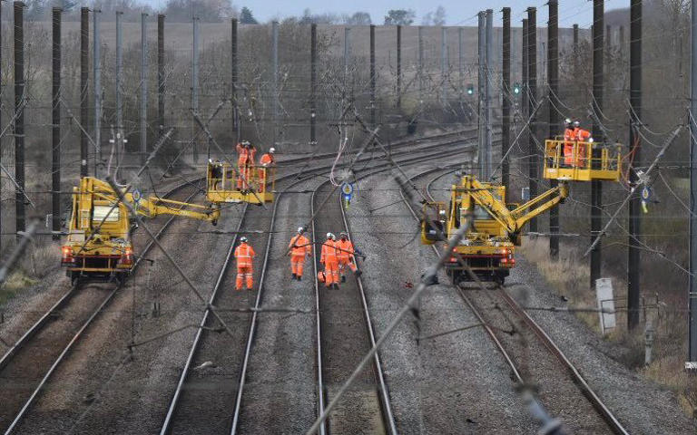 Emergency crews work to restore service on the East Coast main line between Peterborough and Grantham - Twitter/@RiggeMortiss