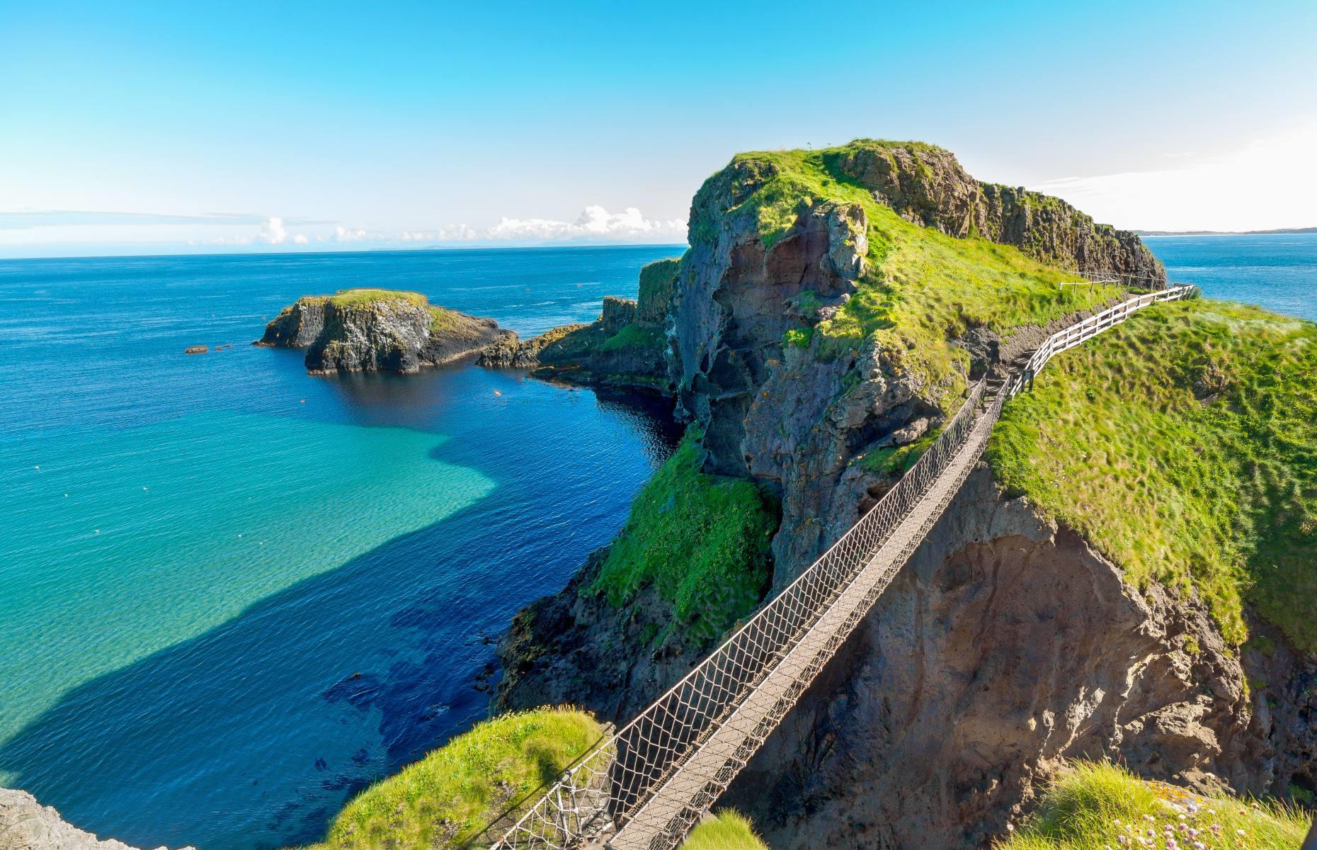 <p>Erected by salmon fishermen more than 250 years ago, the <a href="https://www.nationaltrust.org.uk/carrick-a-rede">Carrick-a-Rede Rope Bridge</a> is one of Northern Ireland’s most incredible landmarks. Built to link the County Antrim mainland to Carrick-a-Rede island, the wooden bridge is suspended 98 feet above the sea and measures roughly 66 feet long. High above the crashing waves of the Atlantic Ocean and surrounded by beautiful coastline, the rope bridge has become a popular tourist attraction for thrill-seekers.</p>