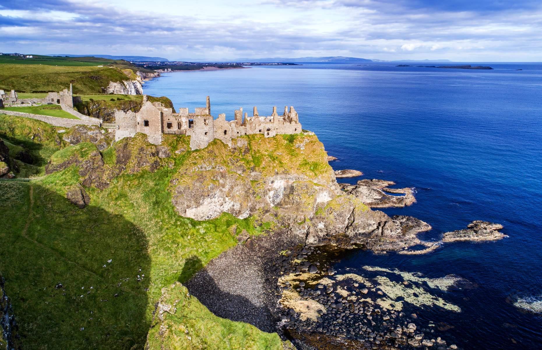 <p>Nestled on a cliff overlooking the Atlantic Ocean, <a href="https://discovernorthernireland.com/things-to-do/dunluce-castle-medieval-irish-castle-on-the-antrim-coast-p675011">Dunluce Castle</a> is one of Northern Ireland’s most breathtaking sights. Originally built around the 13th century by Richard de Burgh, the 2nd Earl of Ulster, the castle was owned by the feuding McQuillan and McDonell clans during the 16th century. By the late 1700s, the castle had been abandoned and left to decay. Set against the stunning backdrop of the County Antrim coast, its picturesque ruins now house historical and archaeological exhibits.</p>