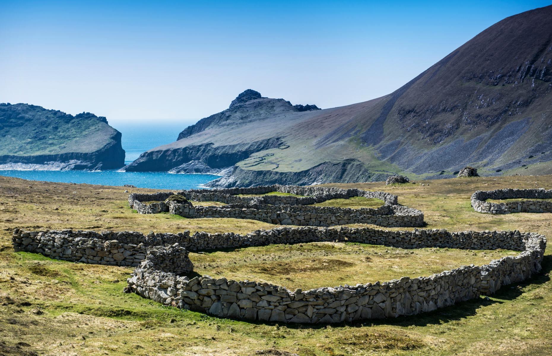 <p>Just off the western coast of Scotland, <a href="https://www.nts.org.uk/visit/places/st-kilda">St Kilda</a> is the most remote part of the British Isles. Hirta is the largest island of the rugged archipelago and was the first to be settled by humans around 4,000-5,000 years ago. By the 1930s Hirta’s last few residents had departed the inhospitable environment for mainland Scotland. Today it’s better known for its birdlife, although stone settlements remain dotted across the island, serving as an eerie reminder of the past.</p>