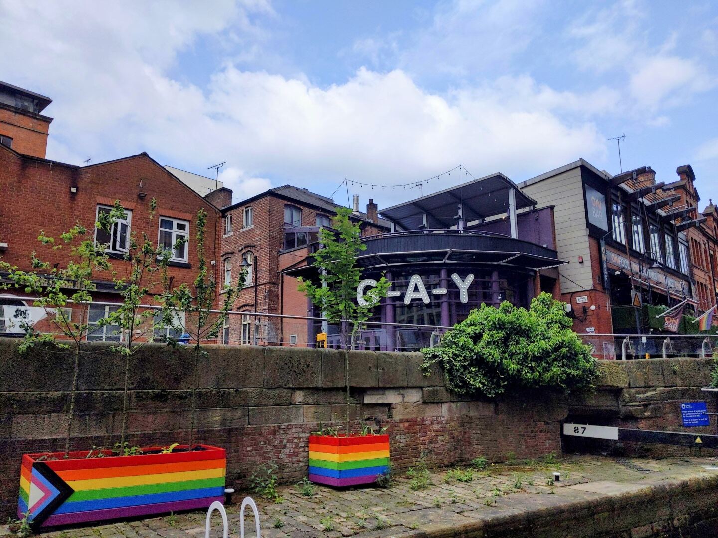 <h2>LGBTQ+ pride</h2> <p>Manchester’s LGBTQ neighborhood along Canal Street, affectionately dubbed Gay Village, is home to one of the oldest openly gay venues in the city: <a class="Link" href="https://www.visitmanchester.com/food-and-drink/new-union-hotel-and-show-bar-p184261" rel="noopener">New Union</a> dates to the 1860s and is now a bar and hotel. Canal Street is also lined with festive-feeling restaurants and bars and wallpapered with posters for drag brunches and shows. In June, the neighborhood is the epicenter for <a class="Link" href="https://www.visitmanchester.com/ideas-and-inspiration/lgbt" rel="noopener">Manchester Pride</a>, and in July it hosts Sparkle, the national transgender celebration. </p> <p>Check out the Visit Manchester website for a <a class="Link" href="https://www.visitmanchester.com/ideas-and-inspiration/manchester-lgbtq-trail" rel="noopener">downloadable LGBTQ self-guided tour</a>, which includes a stop at the Alan Turing memorial. The genius who invented the computer moved here after his code-breaking success in World War II to work at the University of Manchester (the alma mater of Benedict Cumberbatch, who played Turing in the 2014 movie <i>The Imitation Game</i>). Sadly, Manchester is also where Turing was arrested for being gay and sentenced to chemical castration. He was found dead of cyanide poisoning in his home in 1954, at the age of 41. The Queen pardoned him posthumously in 2013. If you’re in the city on any June 23, stop by his <a class="Link" href="https://secretmanchester.com/icons-alan-turing/" rel="noopener">statue</a> in Sackville Gardens; people place flowers there every year for his birthday.</p>