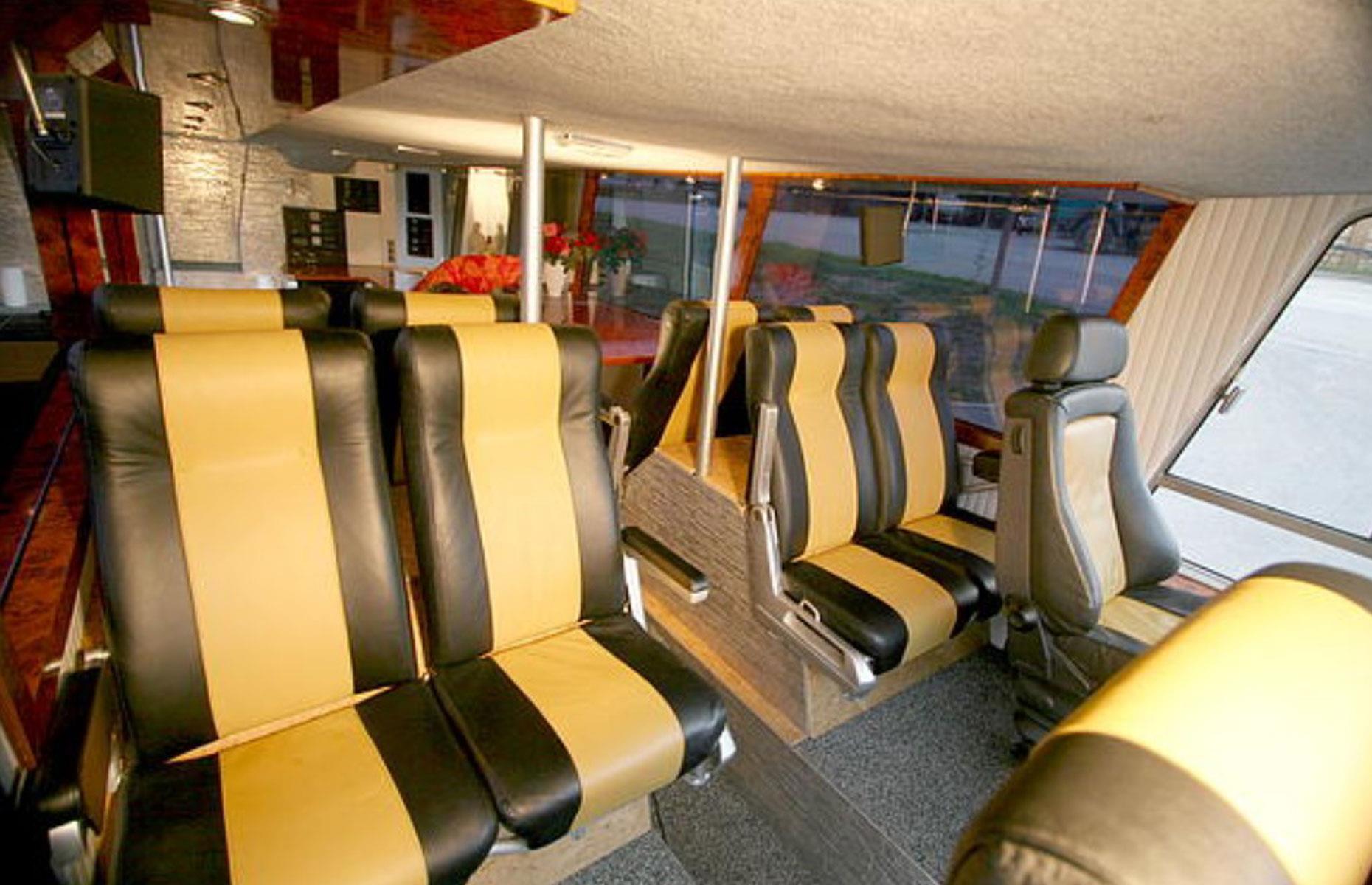 <p>The first level now features eight passenger seats tucked behind the driver's cab, along with a mobile office of sorts. There's a 10-person meeting room and several smaller conference rooms for doing business on the go. </p>  <p>On the same level, there's also a plush VIP lounge with a bar, decorated with an opulent material palette of marble, chrome, hardwood, steel and leather.</p>
