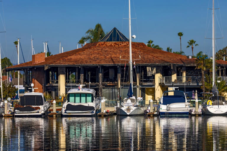 Two firefighters injured fighting a massive overnight fire that destroyed a decades-old California Yacht Club on Tuesday, Dec. 12, 2023 in Marina Del Rey, CA. (Irfan Khan / Los Angeles Times via Getty Images)