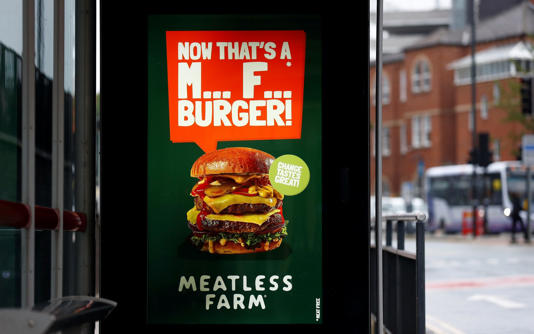 An advert for a burger from Meatless Farm, which stopped trading and let staff go in June before being taken over by another firm - Jason Cairnduff/Reuters