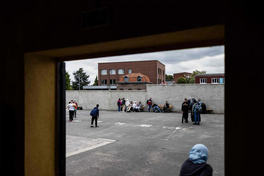 Teenagers play during a break at the Averroes high school in Lille, northern France on Sept. 28, 2023.
