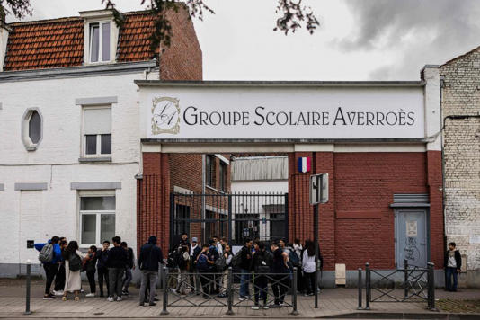 Students leave the Averroes high school in Lille, northern France on Sept. 28, 2023.
