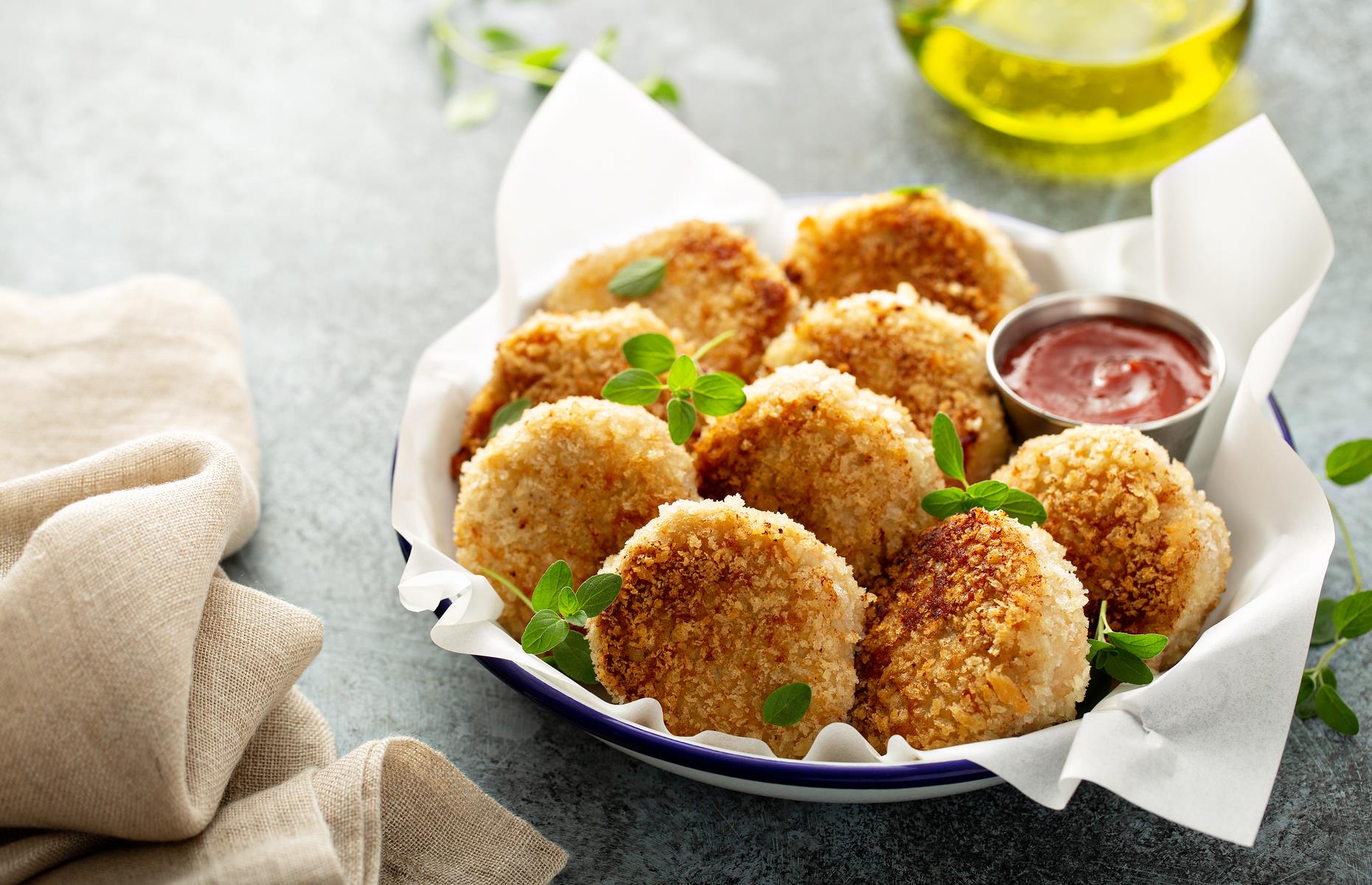 <p>Instead of coating homemade fish cakes in breadcrumbs, for a properly crispy, crunchy outer layer, Nigella recommends covering the raw patties with crushed Ritz Crackers or matzo meal. She also steers clear of frying her fishcakes, particularly when cooking for a crowd, and instead recommends baking them in the oven.</p>