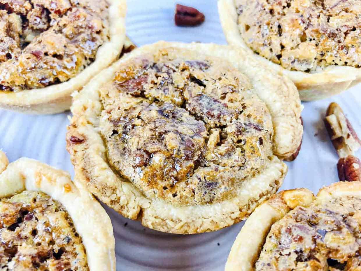 <p>Capture the timeless essence of pecan pie in miniature form, all without corn syrup. These bite-sized delights feature a flaky, buttery crust embracing a sweet and nutty pecan filling, offering the familiar flavors of the classic pie in a convenient, poppable treat.<br><strong>Get the Recipe: </strong><a href="https://littlehousebigalaska.com/2021/10/mini-pecan-pies.html?utm_source=msn&utm_medium=page&utm_campaign=msn">Pecan Pie Tassies</a></p> <p>The post <a href="https://tastesdelicious.com/pecan-pies/">Time-travel with taste: Old-fashioned pecan pies</a> appeared first on <a href="https://tastesdelicious.com">Tastes Delicious</a>.</p>