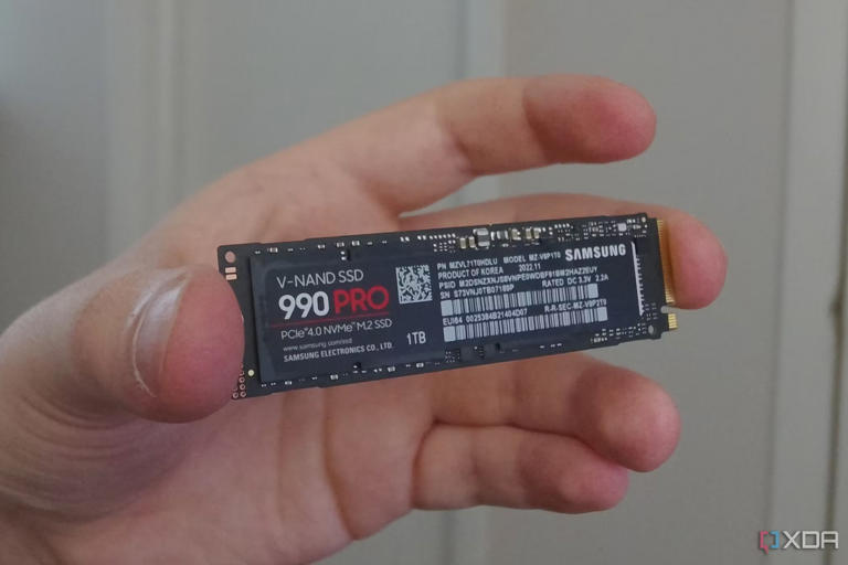 An image showing a person holding Samsung 990 Pro SSD.