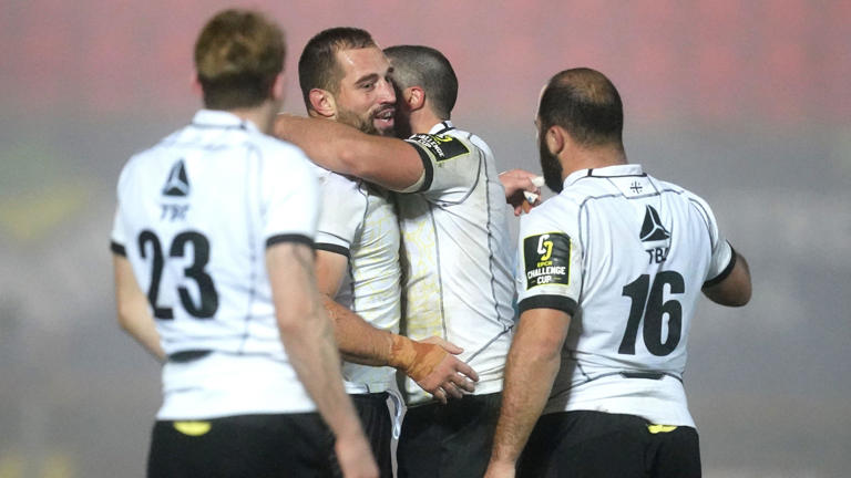 Black Lion team-mates celebrate victory after the final whistle in the EPCR Challenge Cup match at Parc y Scarlets, Llanelli. Picture date: Friday December 15, 2023.