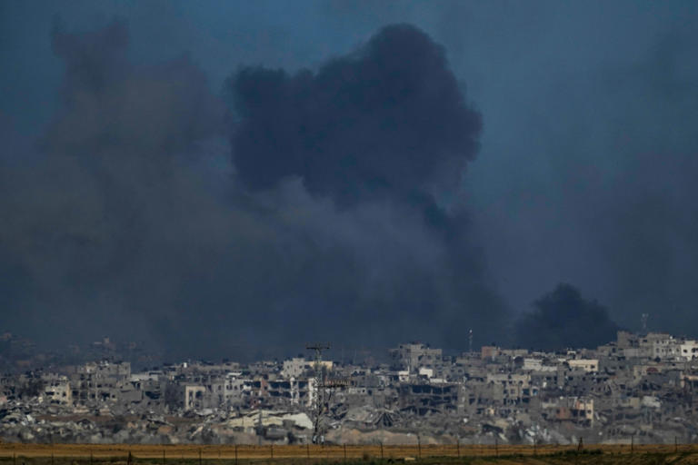 Smoke rises following an Israeli bombardment in the Gaza Strip, as seen from southern Israel, on Boxing Day (AP)