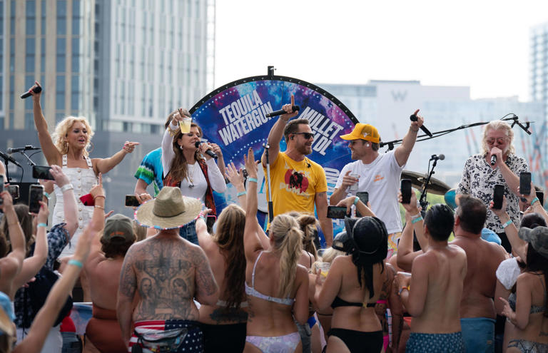 Dustin Lynch, second right, is joined at poolside by Little Big Town at the Margarita Hotel during his "Pool Situation" party on the third day of CMA Fest in Nashville, Tenn., Saturday, June 10, 2023.